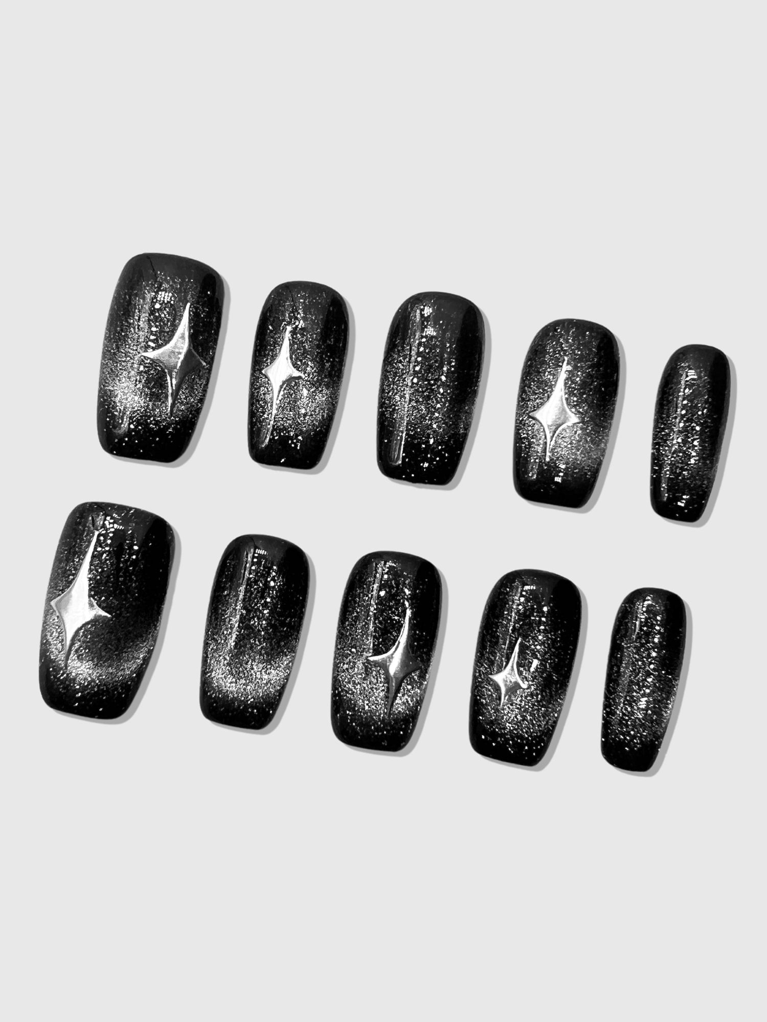 Nekoyanin Stargaze press-on nails featuring a celestial starry design on short, stylish acrylic nail tips.