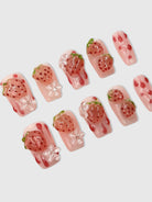 Nekoyanin strawberry shortcake press-on nails with pink and white design, perfect for a cute, quick manicure.