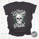 Never Enough Plants pigment dyed graphic tee by The Graphic Tee, featuring vibrant plant-inspired artwork on a casual short-sleeve shirt.