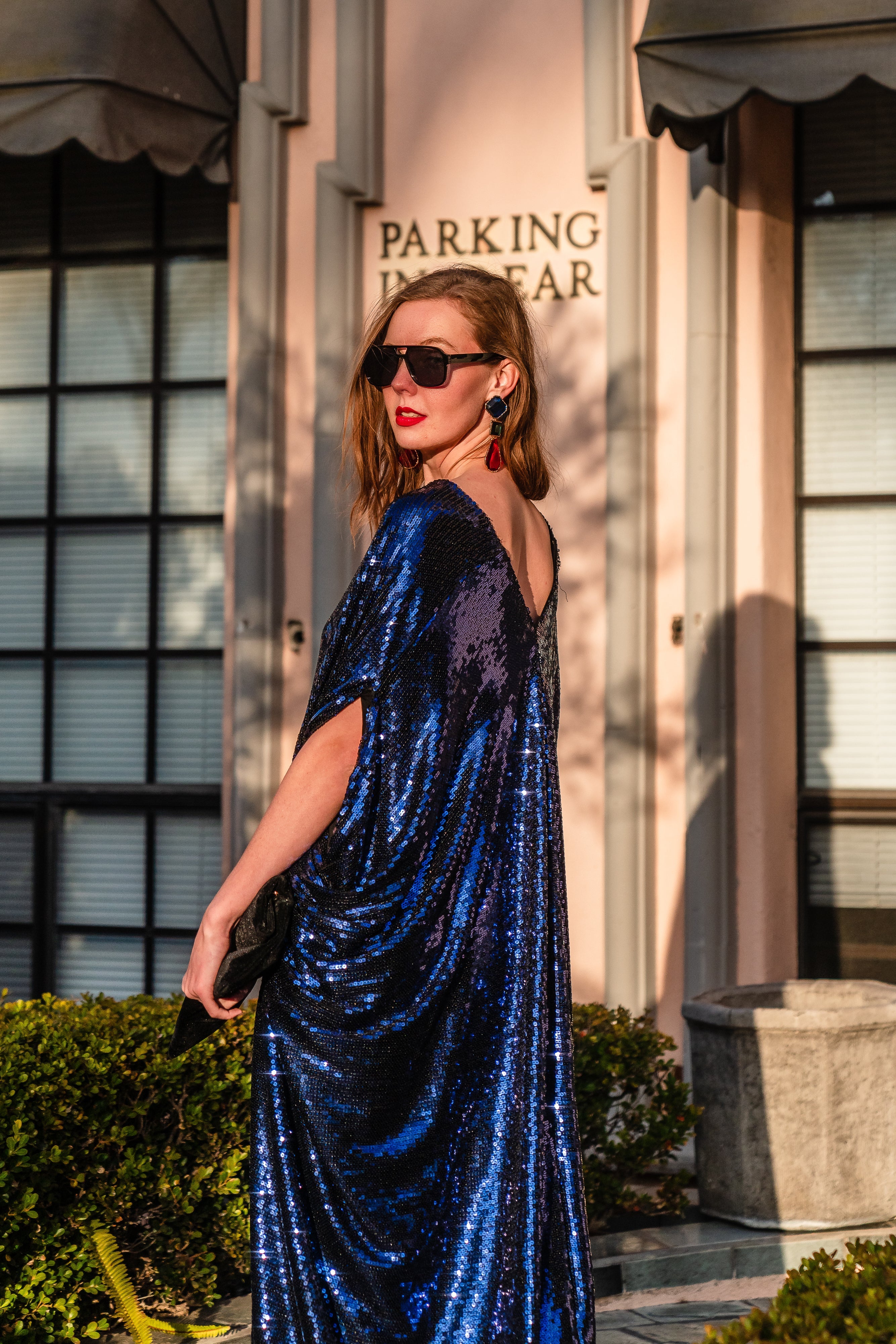 Night sapphire sequin caftan dress by Jennafer Grace featuring intricate beadwork, flowing fabric, and elegant style.