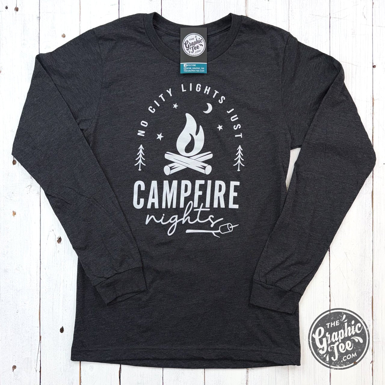 Long sleeve graphic tee by The Graphic Tee featuring a No City Lights Just Campfire Nights design, perfect for cozy outdoor evenings.