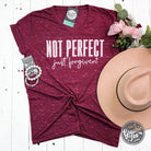 Marbled short sleeve V-neck graphic tee by The Graphic Tee with "Not Perfect Just Forgiven" design, casual and stylish.