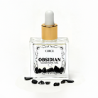 Circe Boutique Crystal Body Oil Trio featuring Obsidian, Rose Quartz, and Citrine gemstones in elegant bottles with natural oils inside.