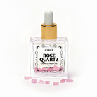Crystal Body Oil Trio with Rose Quartz, Citrine, and Obsidian gemstones in elegant bottles for skincare and gemstone therapy.