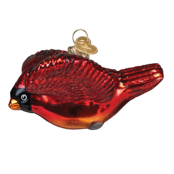 Colorful cardinal in flight ornament by Old World Christmas featuring detailed glass craftsmanship and vibrant red feathers.