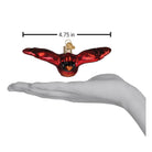 Old World Christmas Cardinal in Flight ornament featuring a vibrant red cardinal perched with detailed feathers.