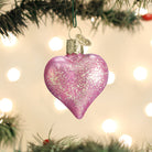 Pink glittered heart ornament from Old World Christmas, featuring a sparkly, decorative heart with festive pink glitter details.