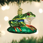 Red-eyed Tree Frog ornament by Old World Christmas featuring vibrant green body, red eyes, and detailed tree frog design.