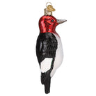 Red-headed Woodpecker ornament by Old World Christmas featuring a vibrant red head, detailed feathers, and a realistic bird design.