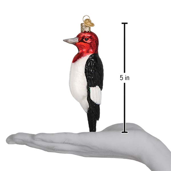 Red-headed Woodpecker Christmas ornament by Old World Christmas, detailed red and black bird decoration with festive design.