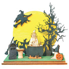 Colorful glass ornament shaped like a witches convention scene, crafted by Old World Christmas for festive holiday decor.