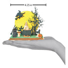 Handcrafted Old World Christmas Witches Convention ornament featuring a whimsical witch figure with colorful details.