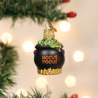 Mini Halloween Cauldron Ornament by Old World Christmas, featuring a small black cauldron with Halloween-themed details.