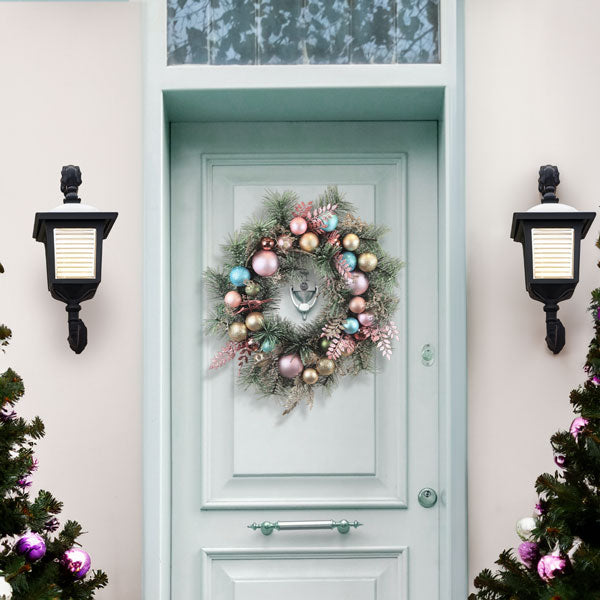 Colorful 24-inch pastel wreath with whimsical accents, crafted by Old World Christmas for festive home decor.