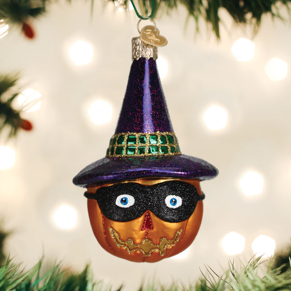 Masked witch Jack O'lantern ornament from Old World Christmas featuring a spooky witch face carved into an orange pumpkin.