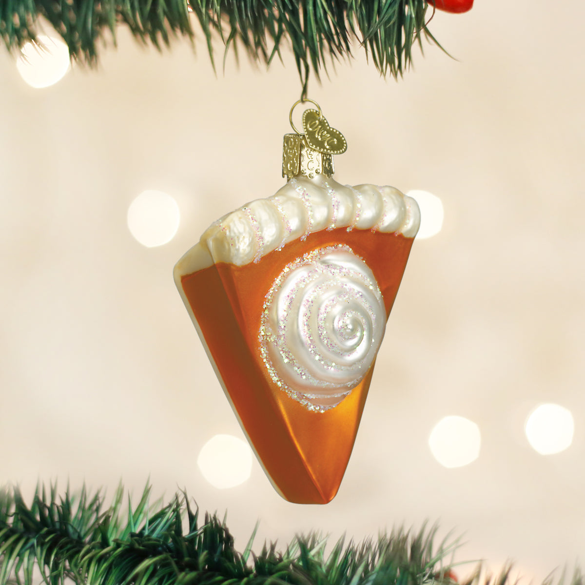 Piece of pumpkin pie ornament by Old World Christmas, detailed glass decoration with a slice of pumpkin pie on a plate.