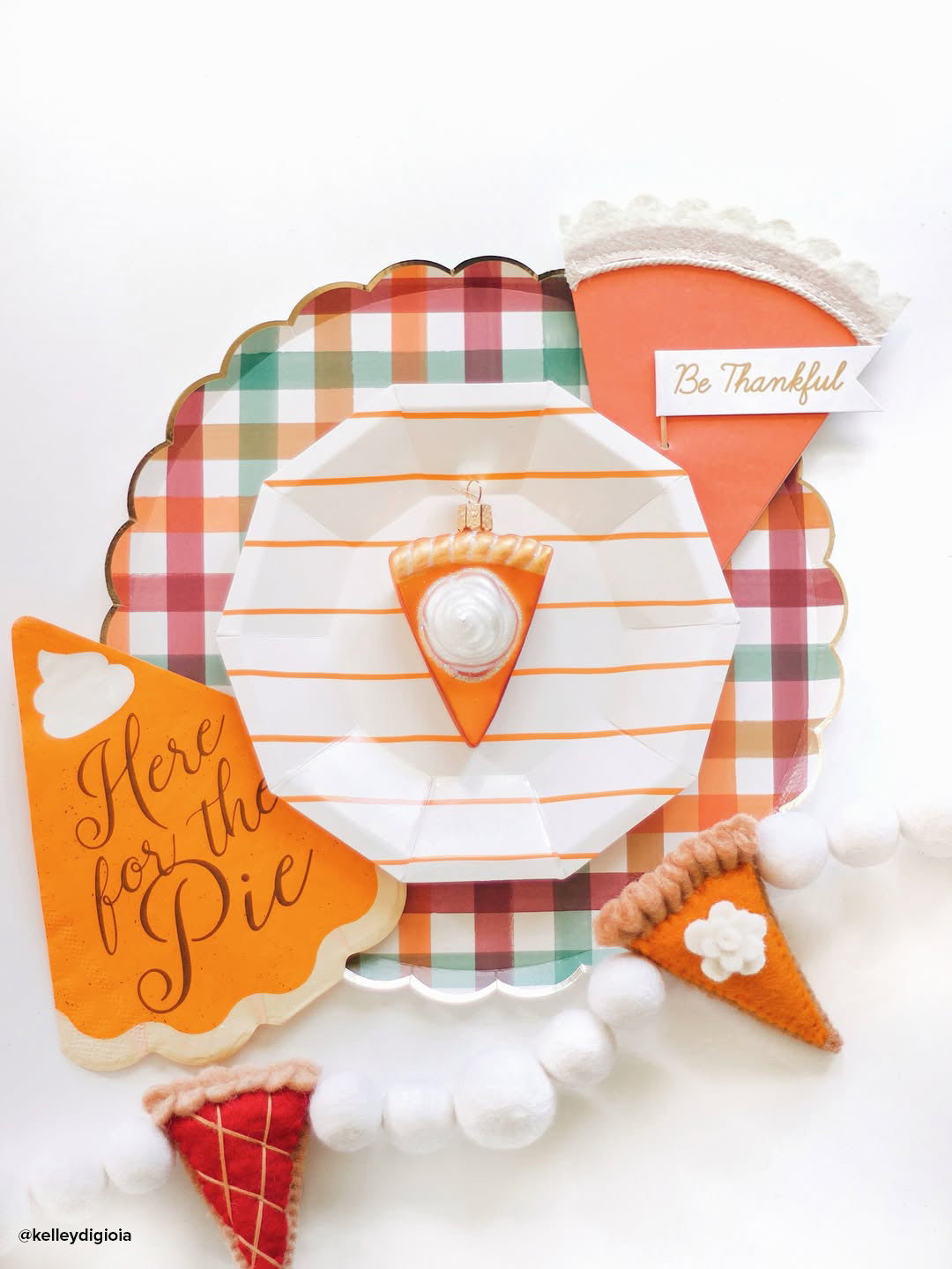 Piece of pumpkin pie ornament by Old World Christmas featuring a slice of pumpkin pie with whipped cream and a festive crust.