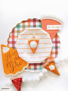 Piece of pumpkin pie ornament by Old World Christmas featuring a slice of pumpkin pie with whipped cream and a festive crust.