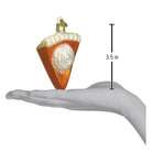 Old World Christmas pumpkin pie ornament, detailed ceramic piece with a slice of pumpkin pie and whipped cream decoration.