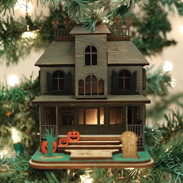 Old World Christmas Haunted Mansion Ornament featuring a spooky haunted house design in vibrant colors and detailed craftsmanship.