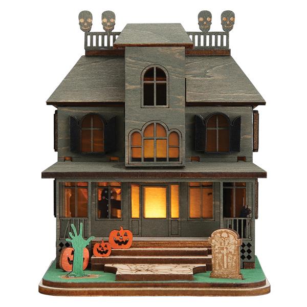 Old World Christmas Haunted Mansion ornament featuring a spooky, detailed haunted house with eerie windows and gothic design.
