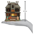 Old World Christmas Haunted Mansion ornament featuring a spooky, detailed haunted house with ghostly accents.