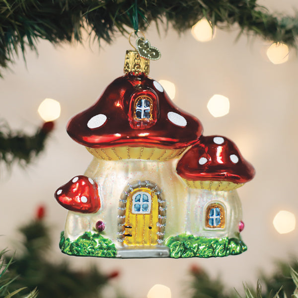 Colorful mushroom house ornament by Old World Christmas featuring detailed painted design and whimsical fairy-tale style.