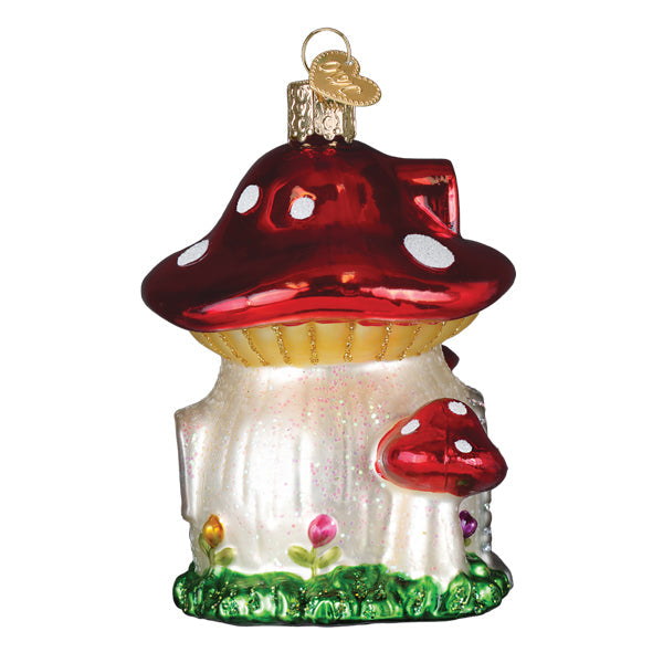 Old World Christmas Mushroom House ornament featuring a whimsical red and white mushroom design with detailed decorations.