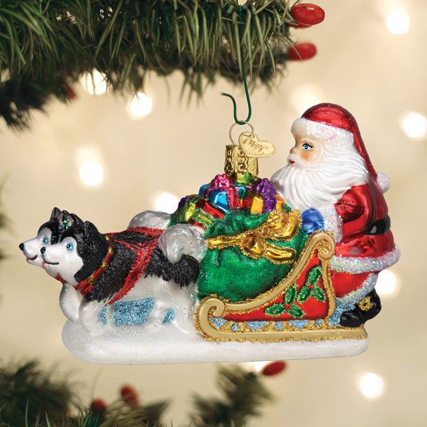 Santa's dog sled ornament by Old World Christmas features a festive dog pulling a sleigh, detailed holiday décor for Christmas trees.