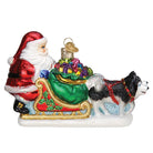 Santa's dog sled ornament from Old World Christmas featuring a detailed festive dog sled with Santa figurine.