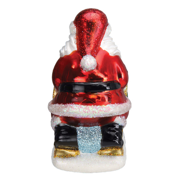 Old World Christmas Santa's Dog Sled Ornament featuring a detailed Santa figure riding a festive dog sled.