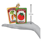 Colorful Old World Christmas garden seeds ornament featuring detailed seed packet design with vibrant illustrations.