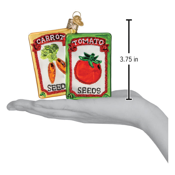 Colorful Old World Christmas garden seeds ornament featuring detailed seed packet design with vibrant illustrations.
