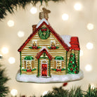 Old World Christmas Christmas Cottage Ornament featuring a detailed festive holiday scene in vibrant colors.
