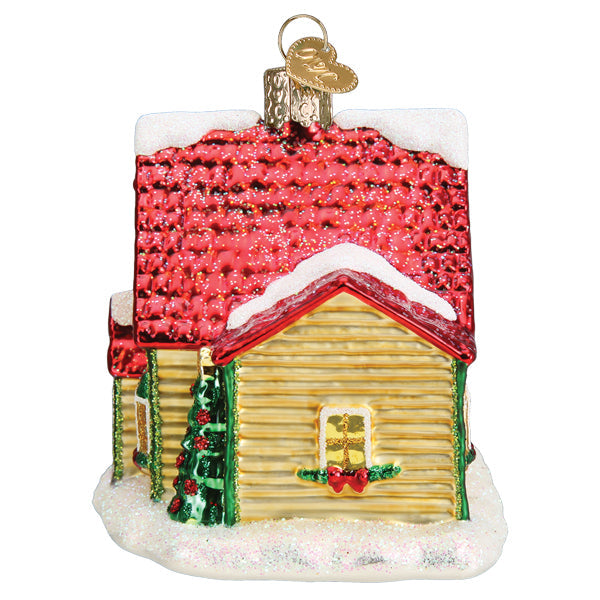 Old World Christmas Christmas Cottage Ornament featuring a detailed miniature holiday cottage with snowy accents and festive decorations.