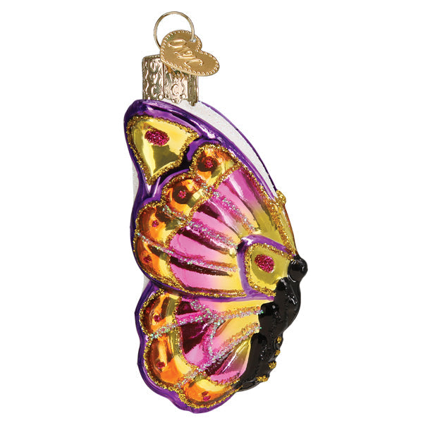 Colorful butterfly ornament from Old World Christmas featuring vibrant wings and intricate details.