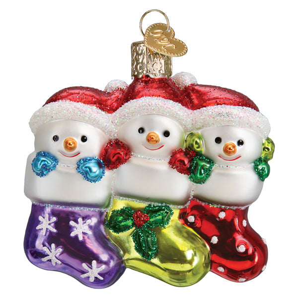 Snow Family of 3 ornament by Old World Christmas, depicting a festive holiday scene with a snow family figure.