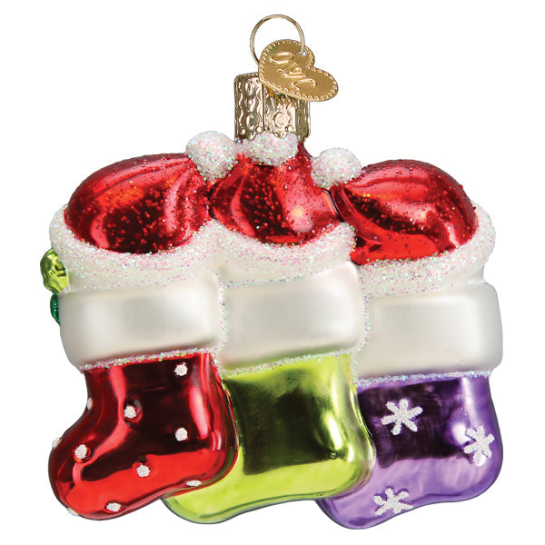 Old World Christmas Snow Family of 3 ornament featuring a festive snow family figurine with winter attire and holiday accessories.