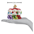 Old World Christmas Snow Family of 3 ornament featuring a festive winter scene with a family of snow figures and holiday decorations.
