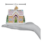 Colorful sugar-coated cottage ornament by Old World Christmas with festive red roof and snowy details, perfect for holiday decor.