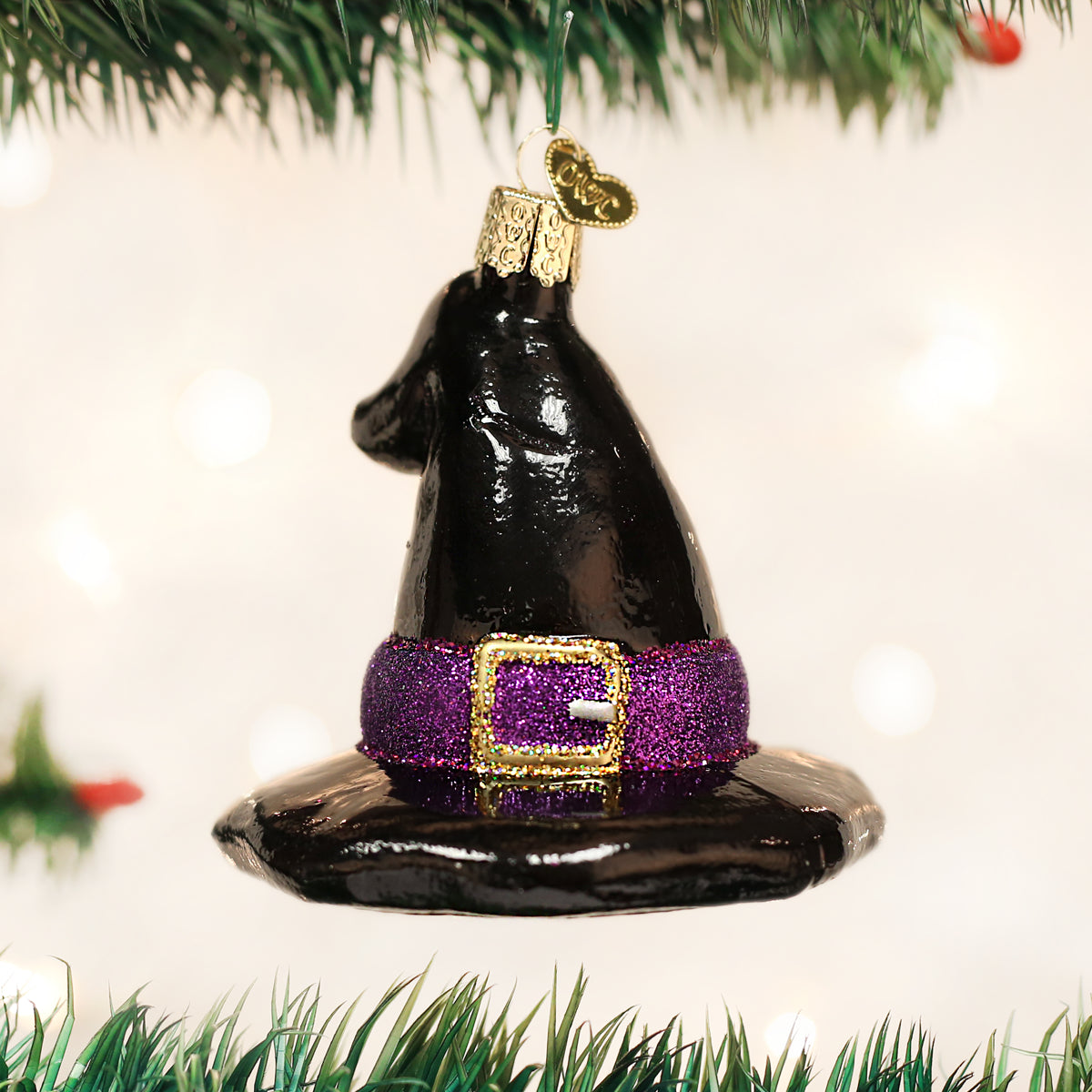 Old World Christmas witch's hat ornament featuring a classic black pointed hat with a buckle, perfect for holiday decor.