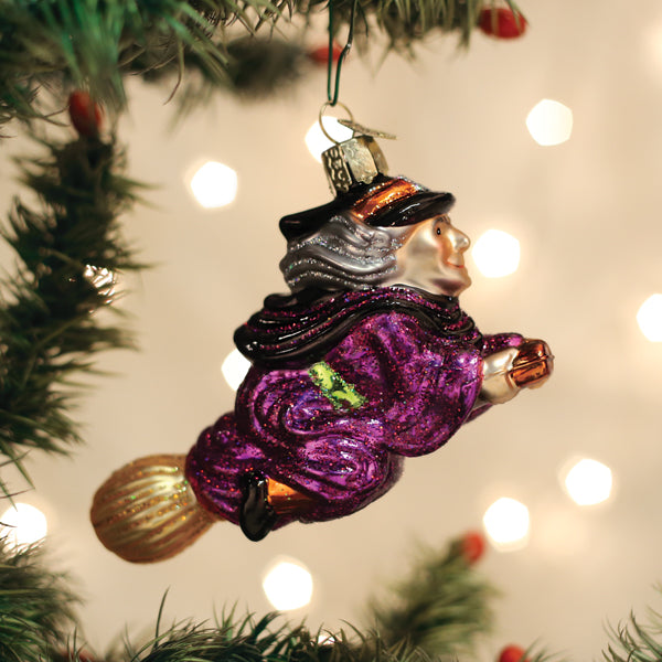 Old World Christmas Witch on Broomstick ornament featuring a detailed witch figure riding a broomstick.