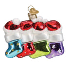 Old World Christmas Snow Family of 4 ornament featuring a festive winter scene with snow-covered figures and holiday decorations.
