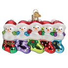 Old World Christmas Snow Family of 5 ornament featuring a festive winter scene with snow-covered figures on a clear background.