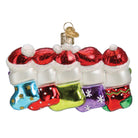 Old World Christmas Snow Family of 5 ornament featuring a festive snow family with winter attire and holiday accessories.