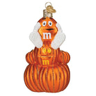 M&M'S orange autumn ornament from Old World Christmas featuring a festive candy shape with detailed orange and brown design