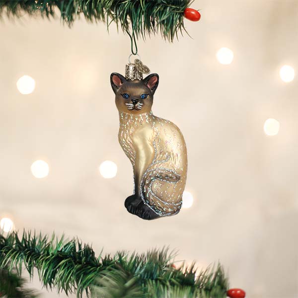 Tan Siamese cat ornament from Old World Christmas featuring a detailed, handcrafted feline figure with a festive design.
