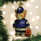 Old World Christmas EMT Teddy Bear ornament featuring a plush teddy bear with medical-themed details, ideal for holiday decor.