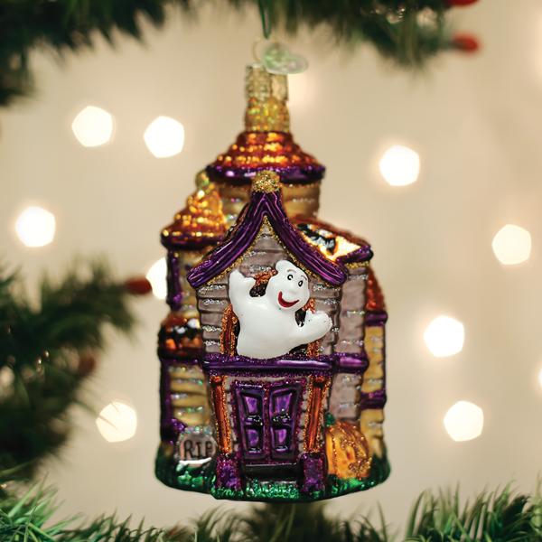 Old World Christmas Haunted Mansion ornament featuring a spooky haunted house design with intricate details and festive charm.