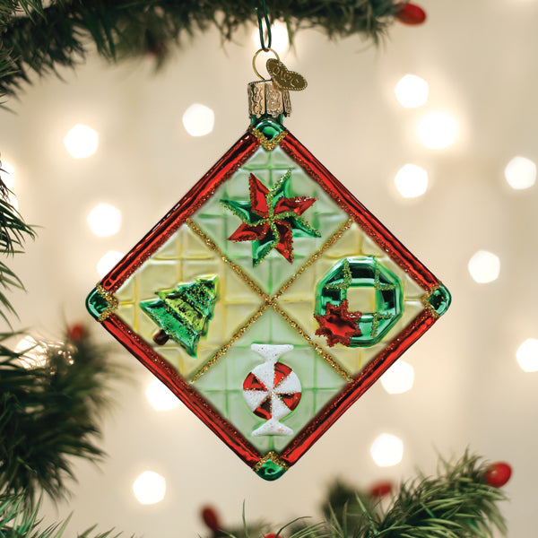 Old World Christmas Christmas quilt ornament featuring intricate fabric patchwork and festive holiday design.